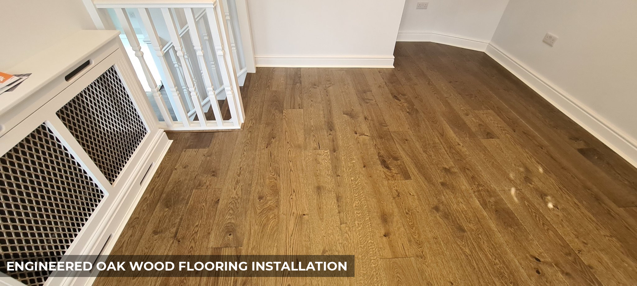 Holt Dorney Engineered Oak Floor Fitting with White Scotia Beading in Brixton